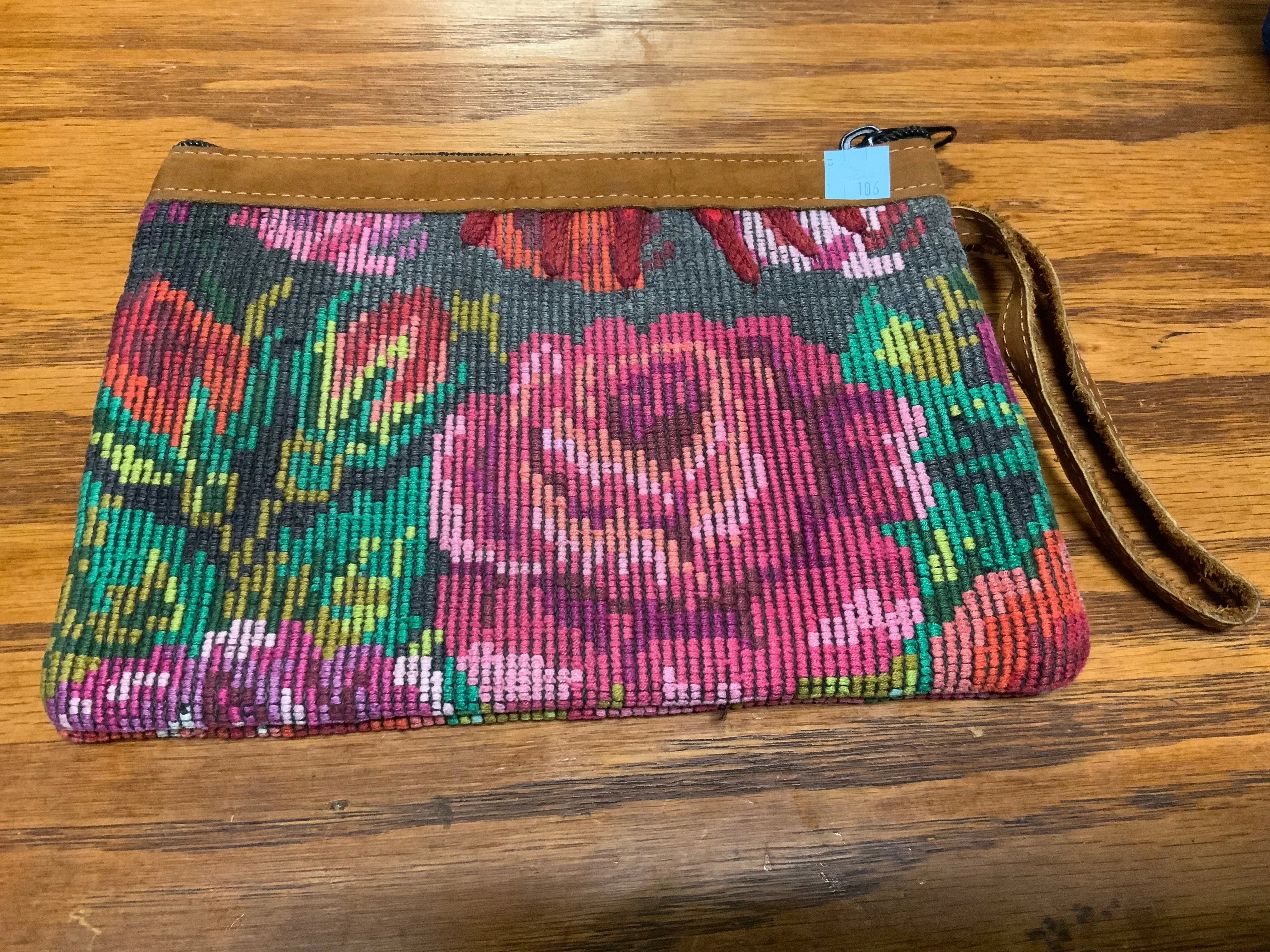 Handwoven vintage fabric wristlet bag with leather. 9” x 6”.