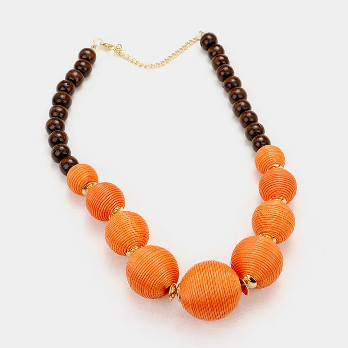 iLLASPARKZ Wood Thread Ball Statement Necklace